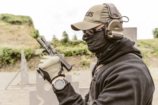 Man with gun in face mask