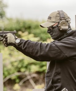 Man in face mask with gun